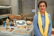 Prof. Salima Ikram with various grave goods of Tut to help him in his afterlife