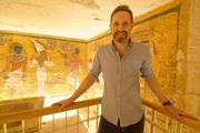 Dr. Chris Naunton - Egyptologist - in Tutankamun's tomb - pictured by the North wall that shows Tutankamun and his successor, Ay, who performs the opening of the mouth ceremony on the dead King's mummy