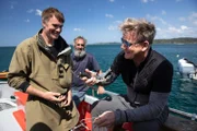 New Zealand - Fluff (center) stands by while Zane (L) and Gordon Ramsay (R) prepare to freedive for pāua, regarded as one of the ocean's greatest delicacies.
