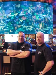 Wayde and Brett posing in front of the finished shark tank.