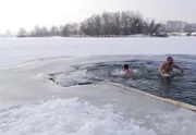 Mans baptism, dipping into a cold hole winter, ice