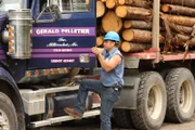 Eldon Pelletier with log hauler truck on the Golden Road in Maine.