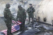 Das US-Militär legt die Geschäftsleute und Regierungsbeamten in die Leichensäcke