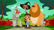 In the back from L-R: The Tin Man (voiced by J. P. Karliak), The Scarecrow (voiced by Bill Fagerbakke), The Cowardly Lion (voiced by Jess Harnell). In the front: Dorothy Gale (voiced by Kari Wahlgren)