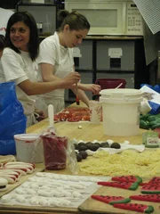 Buffet cake and Coney Island cake. Toni Walton and Sunshine Fernandez work on 'food' items for the Buffet cake.