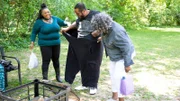 Naomi and Beverly help Drew put on big pants.