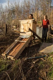 MARS HILL, N.C.- Tony and Amelia take stock of their work on the solar dehydrator. (Photo credit: NG Studios/ Jaye Callahan)