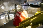 RE-ENACTMENT - As investigators piece together the fuselage in the background, in the foreground sits a piece of the crash, painted a bright red.(photo credit:  Cineflix/Ian Watson)