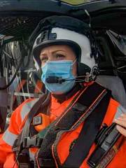 Rachel sitting in the font of the helicopter.