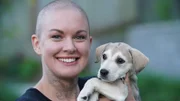 Amanda poses for a picture with Iceland, her latest successfully adopted dog.