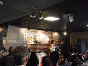 Tia gives a speech at a fundraiser.