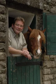Doktor Herbert Dreesen with a horse.