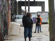 Earl standing out front VRC on phone.