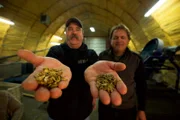 Ken Kerr holding two hands of gold with Dave Young.