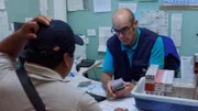 Border control officer counting money