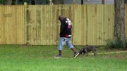 BALLOONS ADOPTION: Earl being filmed walking away with dog from meet and greet area.