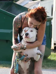 Mariah gives a kiss on Cardigan's head.