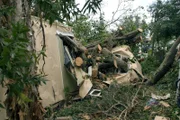 Davie, Broward County, FL 8-27-05 Hurricane Winds from Katrina knocked over huge tree crushing this Mobile home.   These residents had thankfull evacuated.   Many Mobile homes homes are damaged and residents are displaced. MARVIN NAUMAN/FEMA photo