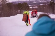 FINNSNES, Norway - Kevin, tow trucker, carrying equipment.