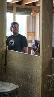 Dan McKernan looking concerned in the donkey corral at Barn Sanctuary.