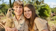 Terri Irwin and Bindi Irwin with meerkat.
