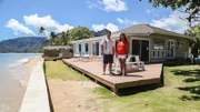 As seen on HGTV's Beach Hunters, homebuyers Amir and Alma pose for a photo after touring the Ocean Breeze House on the island of Oahu.