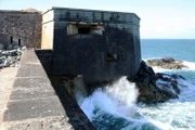 ALDERNEY, CHANNEL ISLANDS - Close up landscape of waves crashing against 3-level bunker at north end of Strongpoint Josefsburg.â€¨â€¨(photo credit:  DSP)