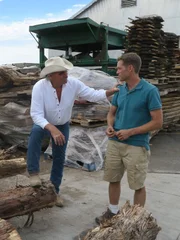 Marty (r.) talking with Chris, saw mill owner.