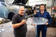 Richard Hammond & Neil Greenhouse posing with the grill they are about to fit to the Mini they are restoring