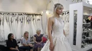 Episode 15, Bride Amaris C tries on dress with friend and family.