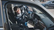 HSI officers search stolen luxury vehicles in the Newark seaport. (National Geographic)