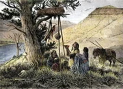 NWI4894790 Geschichte der indigenen Völker: Sioux-Familie, die einem Toten, dessen Grab auf den Ästen der Bäume in Montana liegt, ihr Eigentum anbietet. Farbenfroher Stich aus dem 19. Jahrhundert.