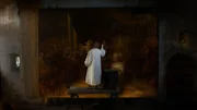 Rembrandt steht auf einer Bank und malt