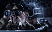 REENACTMENT - Lieutenant Commander G.J. Luther and crew on bridge of HMS Volunteer (Dramatic Recreation).