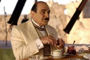 David Suchet (Hercule Poirot).