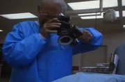 The investigator photographs the evidence.