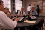 Agents review and exchange their notes at the station