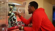 John Wall looking at his finished fish tank.