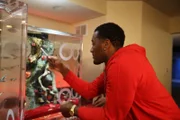 John Wall looking at his finished fish tank.