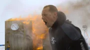 Reaper Mining Captain Kris Kelly reacts to his burning engine shack.