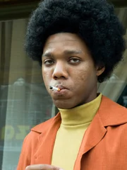 Fred Mitchell smoking a cigarette.