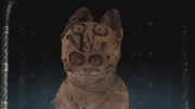 Im Penn Museum in Philadelphia befindet sich ein antikes Leinenbündel mit dem Kopf einer Katze. Der kleine runde Kopf ist aus Stoff gefertigt und an einem länglichen Körper ohne Beine befestigt.