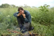 Bear Grylls eating a bull frog in Zambia.