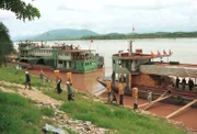 17 Sep 2003, Golden Triangle, South East Asia --- On the Mekong River, fresh fruits from Thailand are exported to China through cross border trade near the central city area known as the "Golden Triangle." Notorious for its history of drug trade focused on opium and heroin, the "Golden Triangle" is a remote outpost on the Mekong River bordering Thailand, Myanmar and Laos. An active government with the backing of the United Nations has made the move towards the eradication of poppy cultivation and has led to a silence in drug trafficking. Yet, many countries including the United States are skeptical, and the area is still looked at as a leading narcotics hub. --- Image by © Pallava Bagla/Corbis