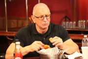 Robert tries some of the Copper Steer's dishes, as seen on Restaurant Impossible, Season 14.