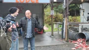 Host Anthony Melchiorri talks to Glacier Bear Lodge's fish gutter about the dangers of leaving fish guts in an open container, as seen on Travel Channel's Hotel Impossible.
