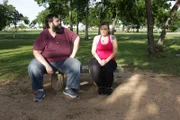 Brittani and her husband Bill sit in the park.