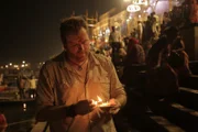 Josh Gates performs his own form of Puja.
