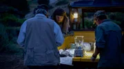 Chad Ollinger, Charlie Snider and Eric Drummond experiment with green liquid in the back of a four wheeler at dusk.