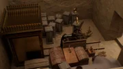 A computer-generated-image shows a wooden Anubis statue standing in a room of Tutankhamun's tomb.
